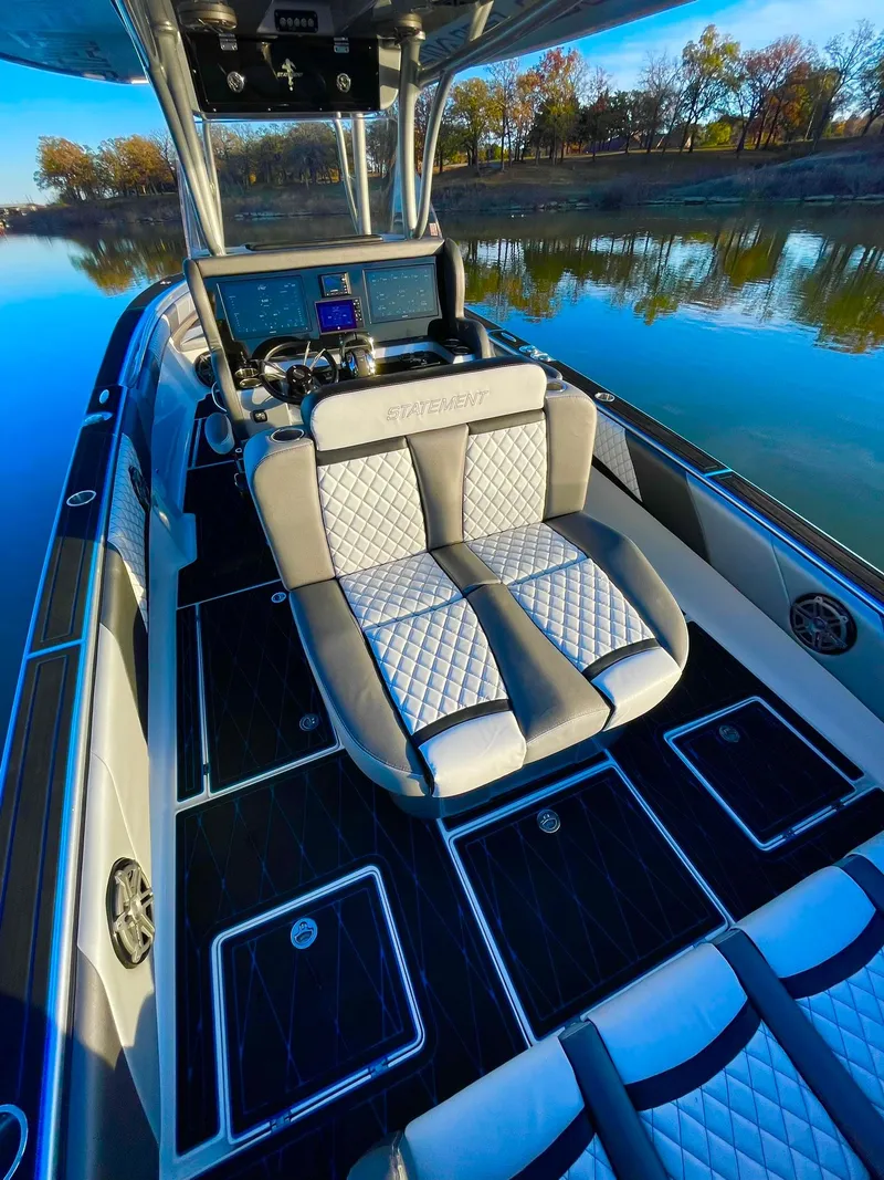 Slide: The Image of 2020 Statement 350 Open boat interior with luxurious seating on a calm lake. - 33