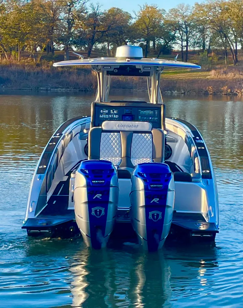 Slide: The Image of 2020 Statement 350 Open boat with dual engines on a serene lake. - 39