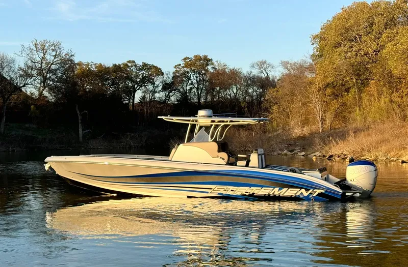 Slide: The Image of 2020 Statement 350 Open boat on calm water, surrounded by trees. - 4