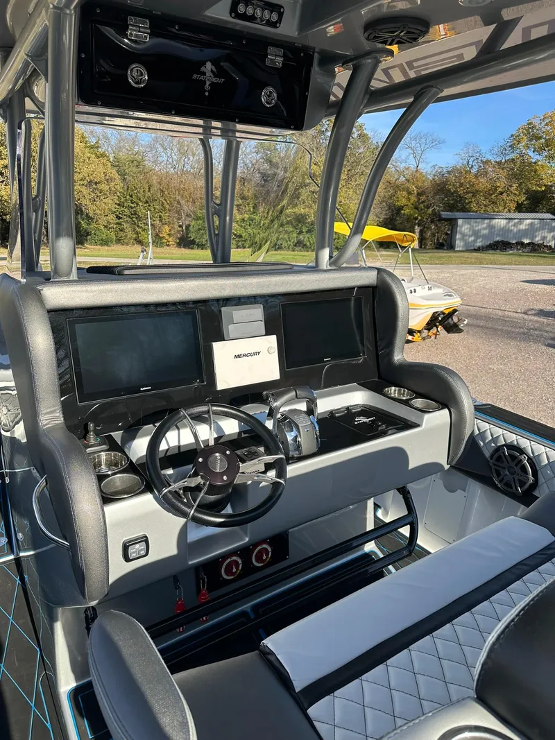 Slide: The Image of 2020 Statement 350 Open boat cockpit with modern controls and dual screens. - 44