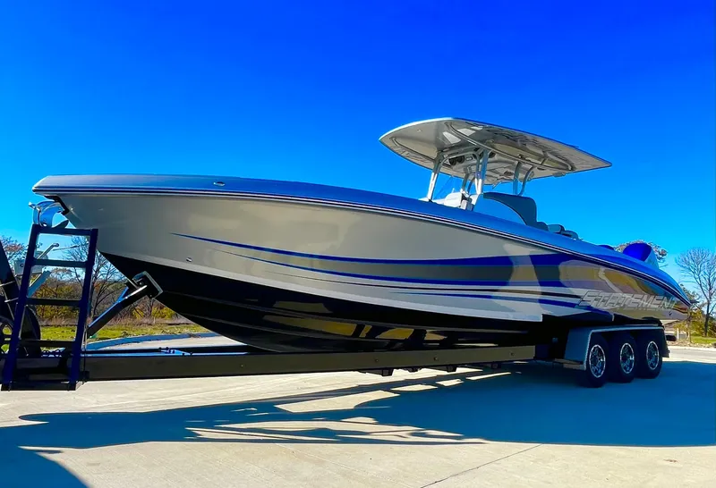 Slide: The Image of 2020 Statement 350 Open boat on trailer under clear blue sky. - 7