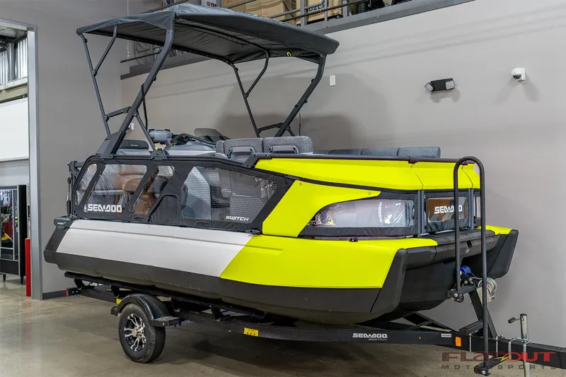 Slide: The Image of 2024 Sea-Doo SWITCH CRUISE 18 230HP boat on trailer, vibrant yellow and gray design. - 2