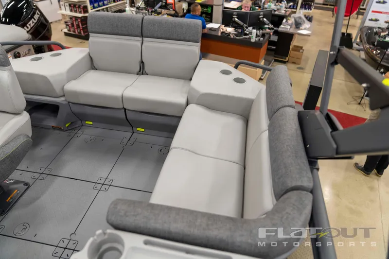Slide: The Image of 2024 Sea-Doo SWITCH CRUISE 18 230HP interior with gray seating in showroom. - 7