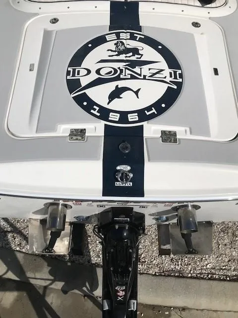 Slide: The Image of 2018 Donzi 22 Classic boat stern with logo and outboard motor. - 10