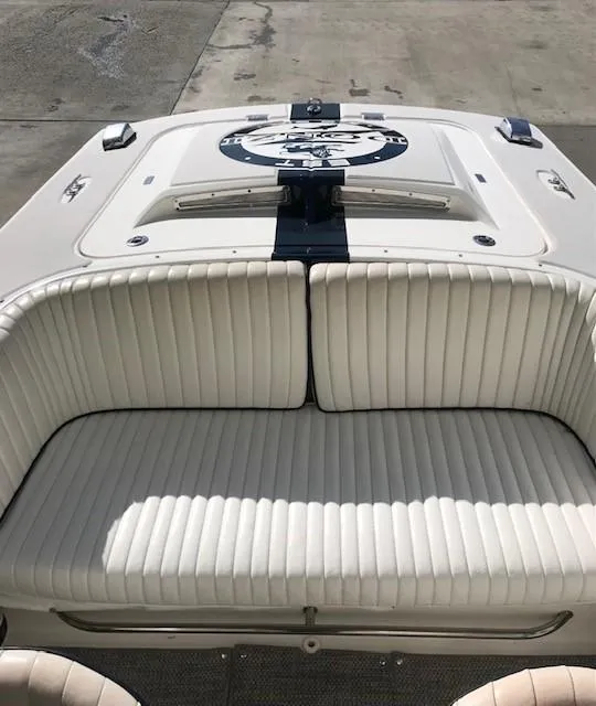 Slide: The Image of 2018 Donzi 22 Classic boat with white cushioned seating and sleek design. - 15