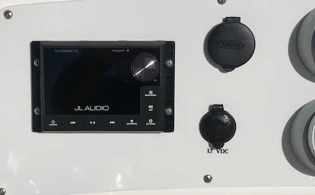 Slide: The Image of JL Audio system on 2018 Donzi 22 Classic dashboard with 12V DC outlets. - 16
