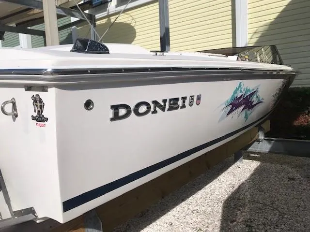 Slide: The Image of 2018 Donzi 22 Classic boat with sleek design and vibrant graphics. - 2