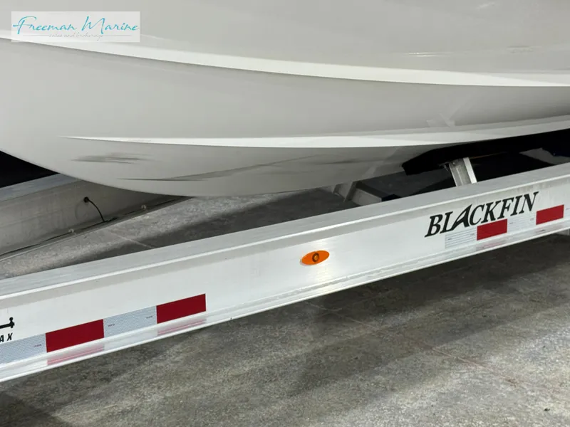 Slide: The Image of 2022 Blackfin 332 CC boat on trailer, side view. - 15