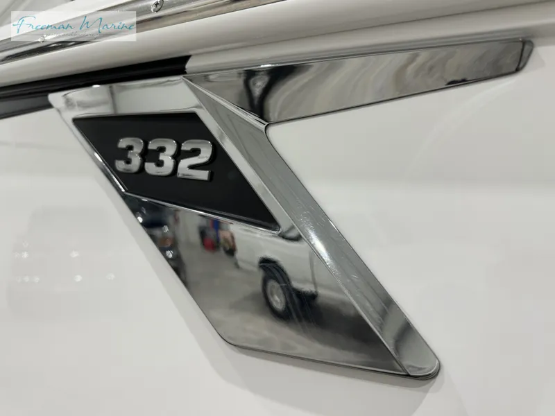 Slide: The Image of 2022 Blackfin 332 CC boat emblem with sleek chrome design. - 18