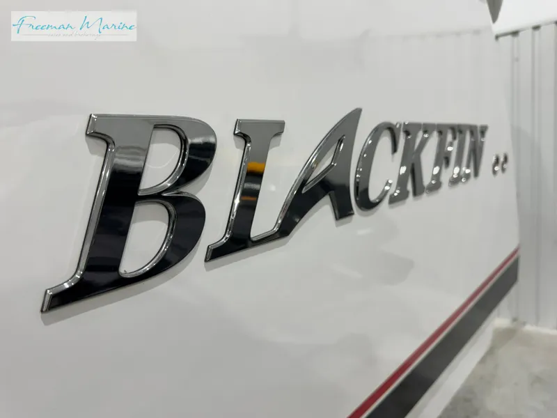 Slide: The Image of 2022 Blackfin 332 CC boat logo on white surface. - 19