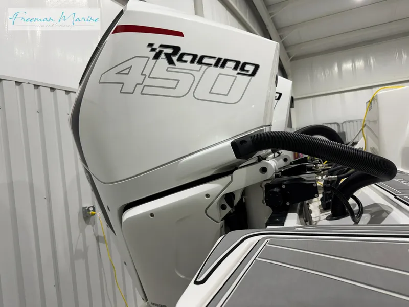 Slide: The Image of 2022 Blackfin 332 CC with Racing 450 engine in a storage facility. - 25