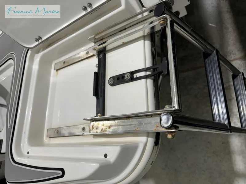 Slide: The Image of 2022 Blackfin 332 CC boat ladder detail, stainless steel and white finish. - 27