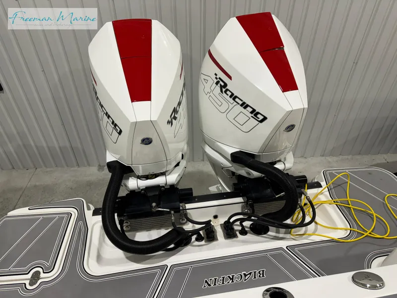 Slide: The Image of 2022 Blackfin 332 CC boat with twin Mercury Racing 450 engines. - 30