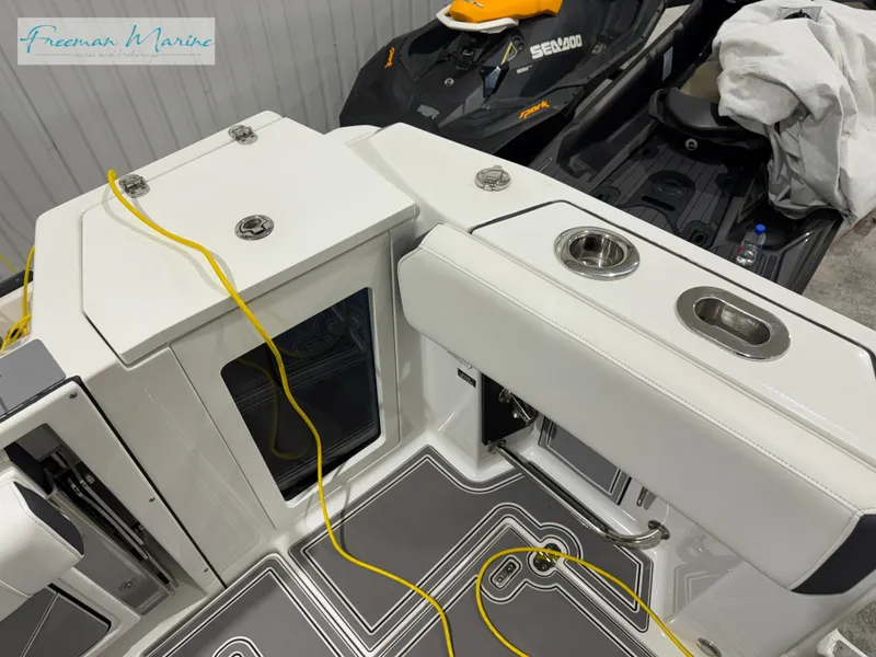 Slide: The Image of 2022 Blackfin 332 CC boat interior with seating and storage compartments. - 31