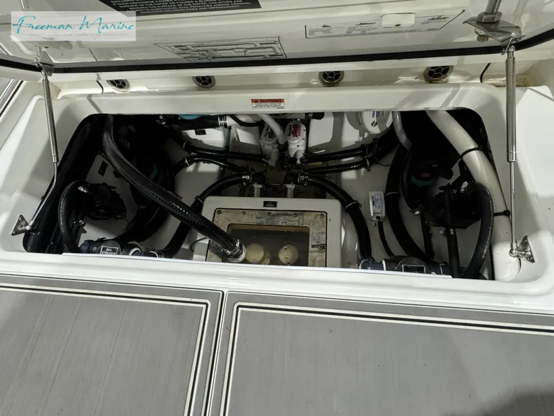 Slide: The Image of 2022 Blackfin 332 CC engine compartment with visible wiring and components. - 34