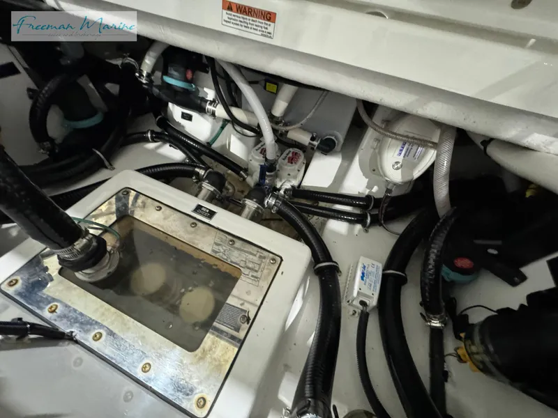 Slide: The Image of 2022 Blackfin 332 CC engine compartment with visible wiring and components. - 37