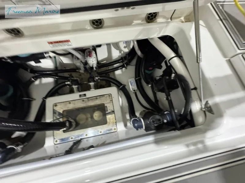 Slide: The Image of 2022 Blackfin 332 CC engine compartment with visible wiring and components. - 40