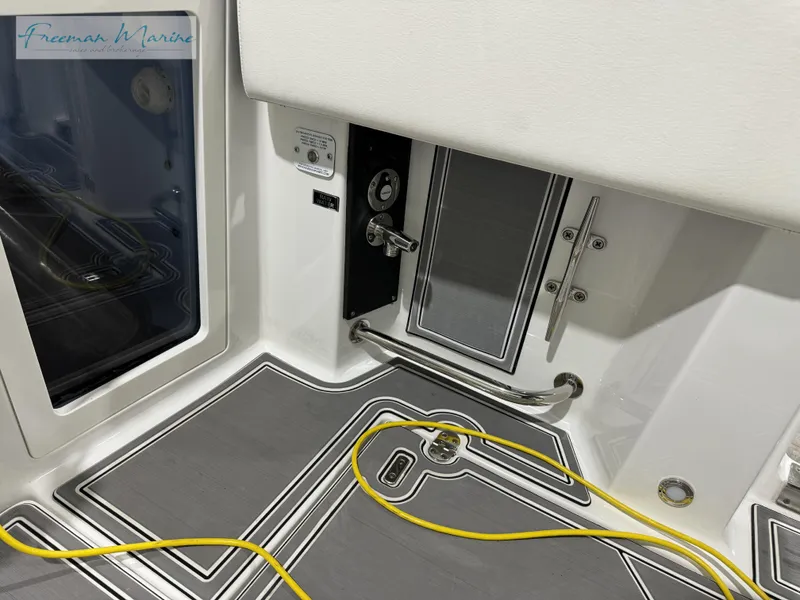 Slide: The Image of 2022 Blackfin 332 CC boat interior with yellow cable and sleek design. - 41
