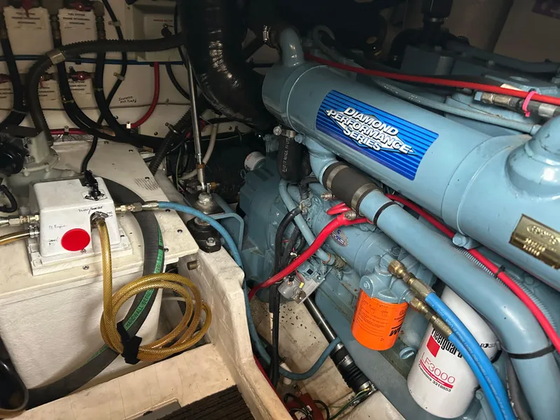 Slide: The Image of Engine room of a 1997 Tiara Yachts 3500 Express, featuring a Diamond Performance engine. - 13