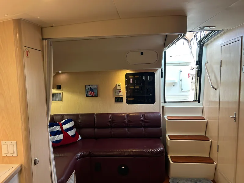 Slide: The Image of Interior of 1997 Tiara Yachts 3500 Express with leather seating and wooden steps. - 30