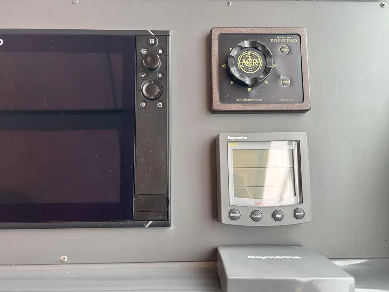 Slide: The Image of Control panel of a 1997 Tiara Yachts 3500 Express with navigation instruments. - 36