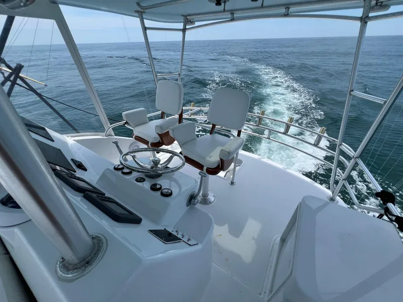 Slide: The Image of 2001 Ocean 52 Convertible yacht helm with ocean view. - 12