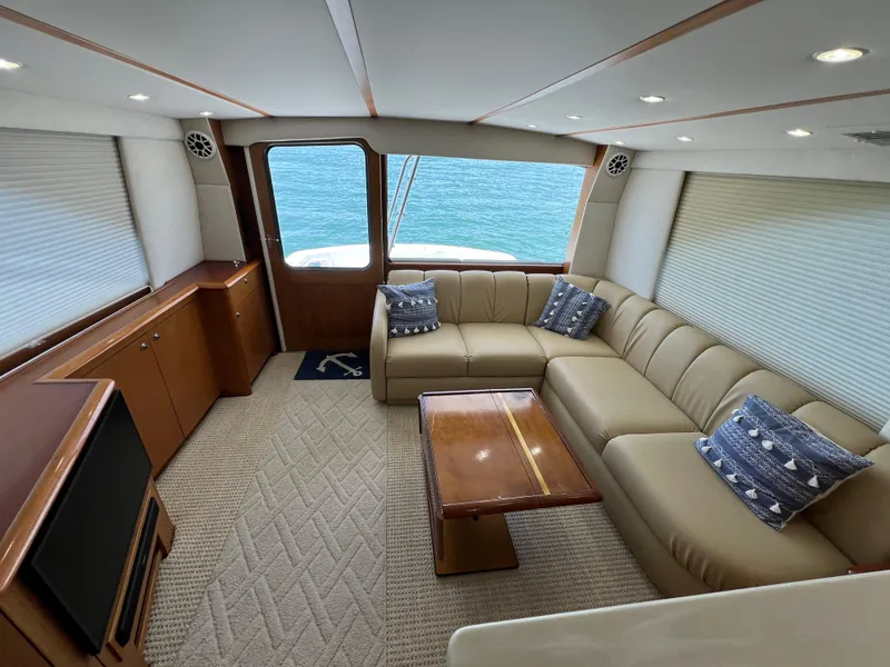 Slide: The Image of Luxurious interior of 2001 Ocean 52 Convertible yacht with beige leather seating and ocean view. - 15