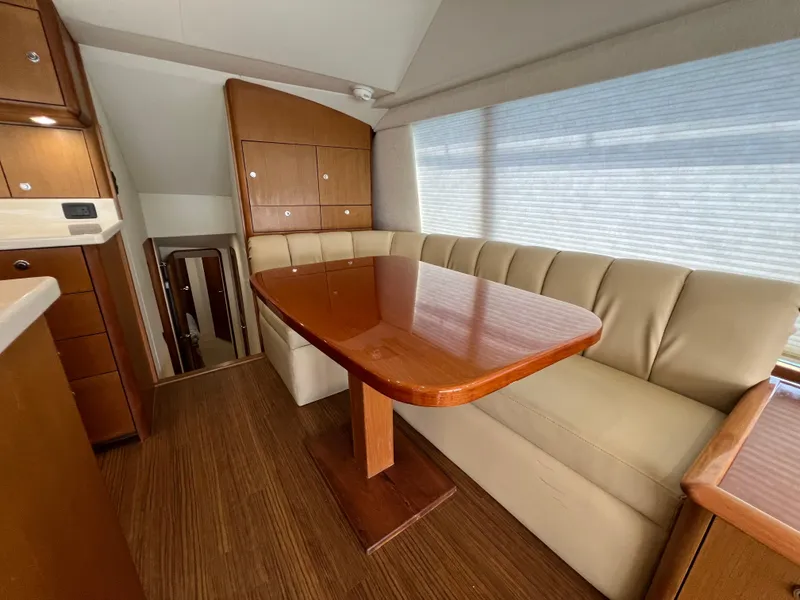 Slide: The Image of Luxurious interior of 2001 Ocean 52 Convertible yacht with elegant dining area. - 18