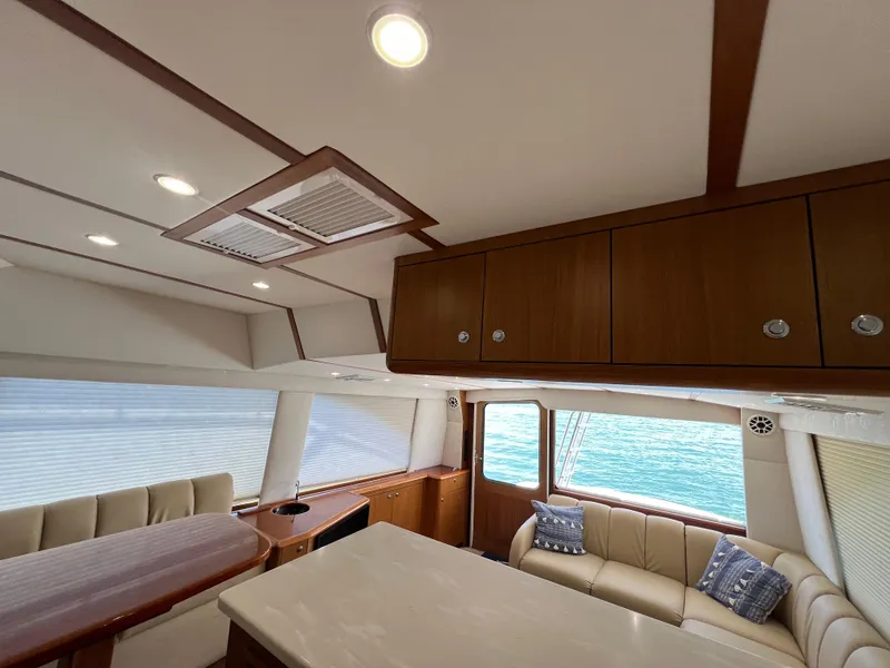Slide: The Image of Interior of 2001 Ocean 52 Convertible yacht with elegant seating and ocean view. - 20