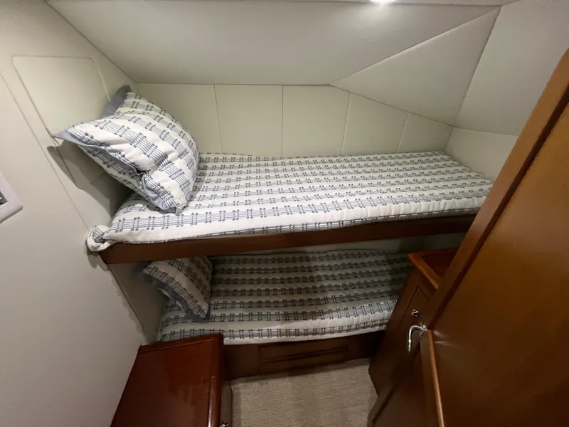 Slide: The Image of Bunk beds in 2001 Ocean 52 Convertible yacht cabin with patterned bedding. - 31