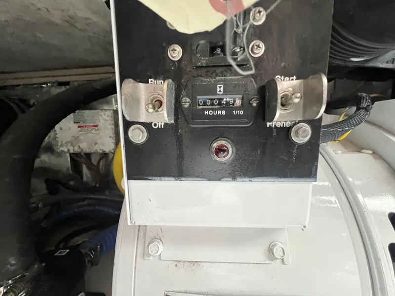 Slide: The Image of Close-up of a 2001 Ocean 52 Convertible engine hour meter showing 49 hours. - 34