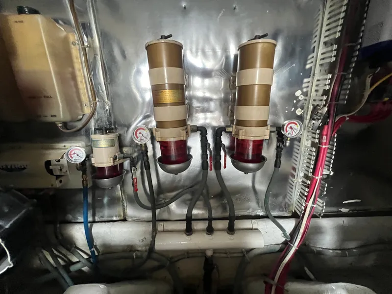 Slide: The Image of Engine room of 2001 Ocean 52 Convertible with fuel filters and gauges. - 38