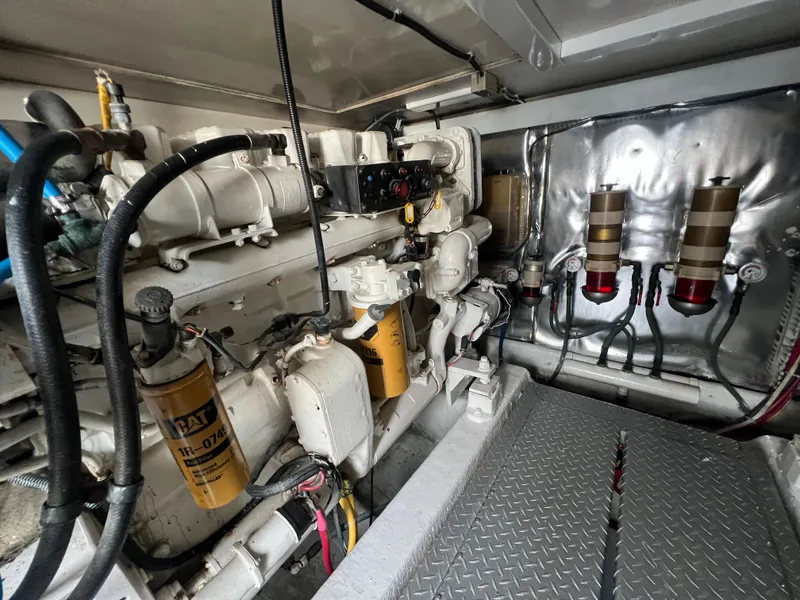 Slide: The Image of Engine room of 2001 Ocean 52 Convertible yacht with visible machinery and components. - 39