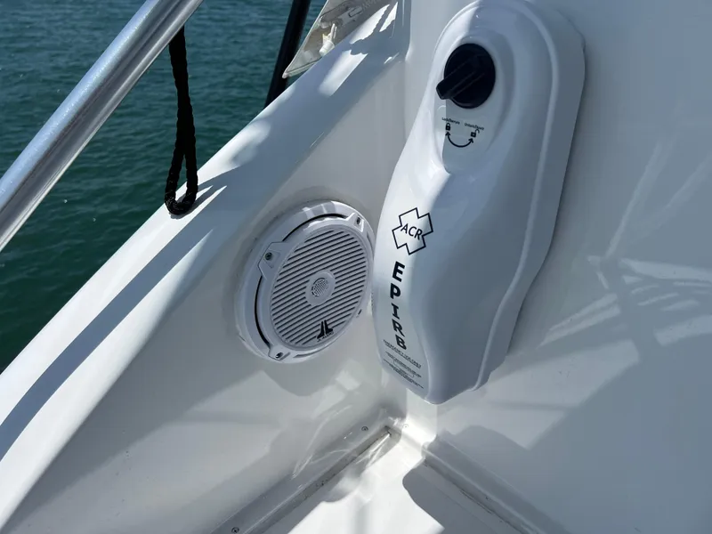 Slide: The Image of EPIRB and speaker on 2001 Ocean 52 Convertible yacht deck. - 44