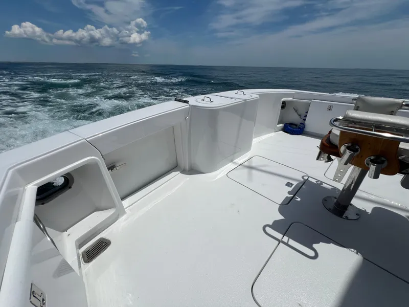 Slide: The Image of Ocean 52 Convertible 2001 yacht deck with ocean view and clear skies. - 8