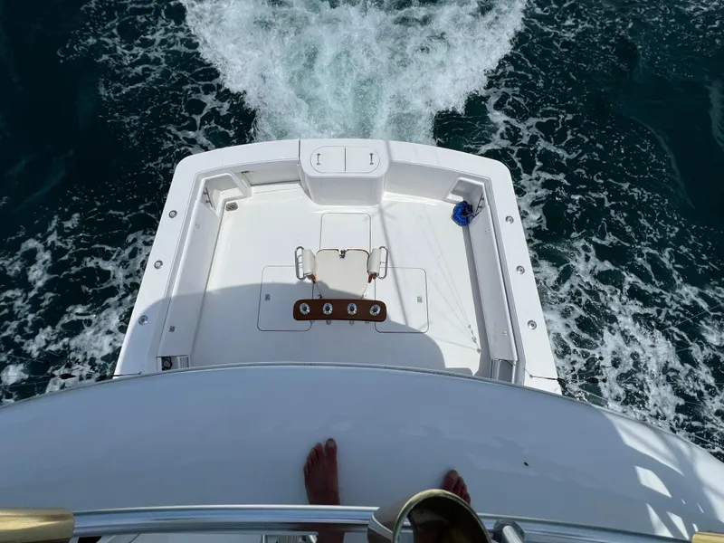 Slide: The Image of Aerial view of 2001 Ocean 52 Convertible yacht deck cruising through water. - 9