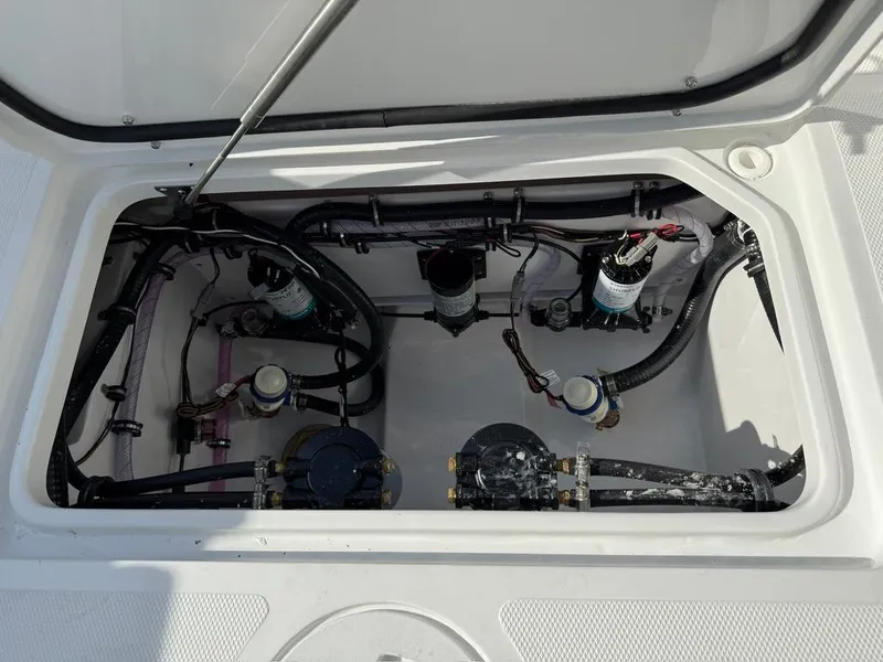 Slide: The Image of 2025 Sea Hunt Gamefish 28 Coffin Box interior with visible wiring and components. - 11
