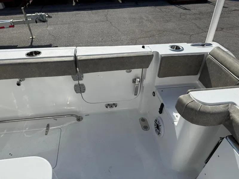 Slide: The Image of 2025 Sea Hunt Gamefish 28 interior with coffin box, featuring seating and storage. - 13