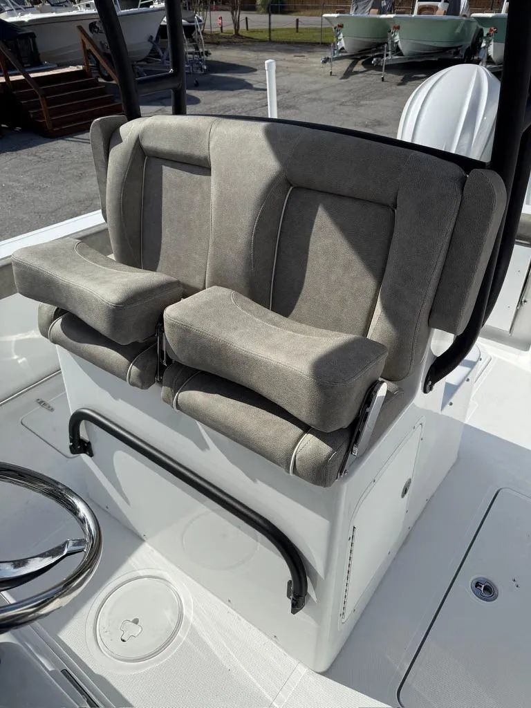Slide: The Image of 2025 Sea Hunt Gamefish 28 boat seating with coffin box, gray upholstery. - 7