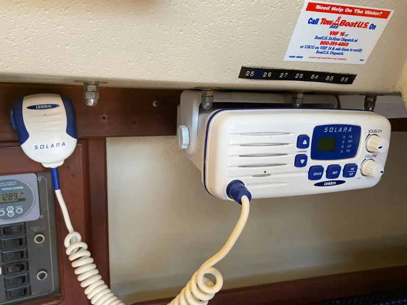 Slide: The Image of Solara marine radio on 1988 Catalina 30 sailboat, featuring a microphone and control panel. - 27