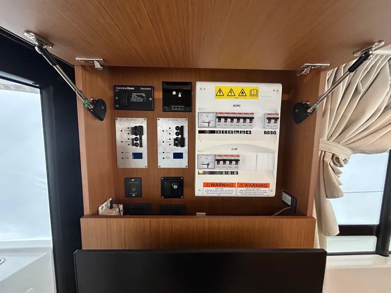 Slide: The Image of Electrical panel inside 2023 Beneteau Swift Trawler 35 yacht cabin. - 18
