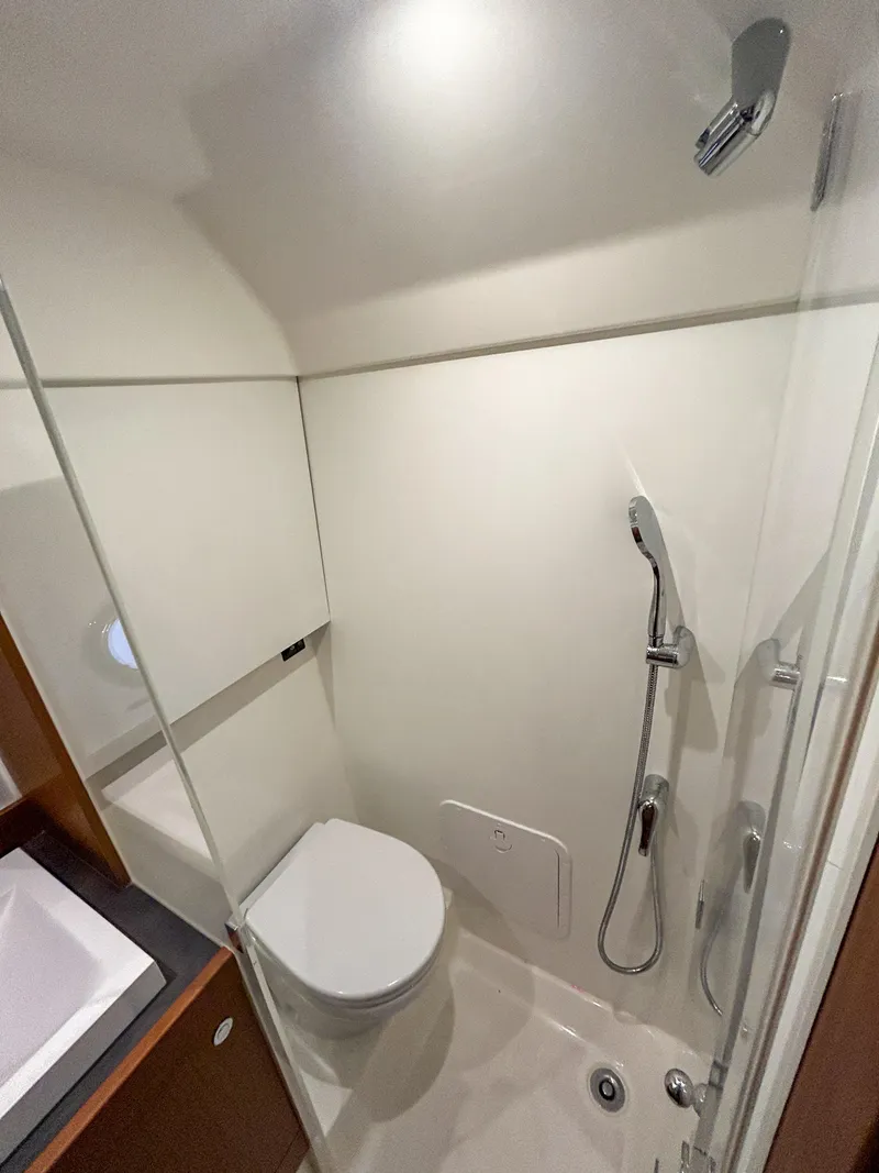 Slide: The Image of 2023 Beneteau Swift Trawler 35 bathroom with modern shower and toilet. - 26