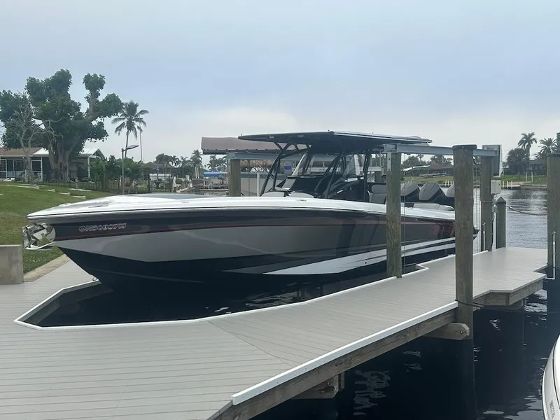 The Image of 2024 Nor-Tech 340 Sport Center Console docked, sleek design, modern features, waterfront setting. - 0