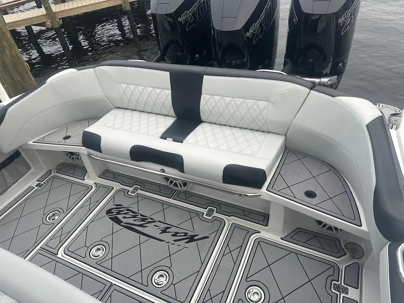 Slide: The Image of 2024 Nor-Tech 340 Sport Center Console with stylish seating and powerful engines. - 10