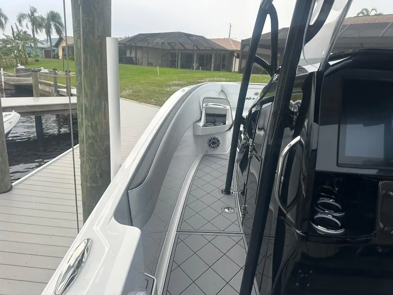 Slide: The Image of 2024 Nor-Tech 340 Sport Center Console docked, showcasing sleek design and modern features. - 15