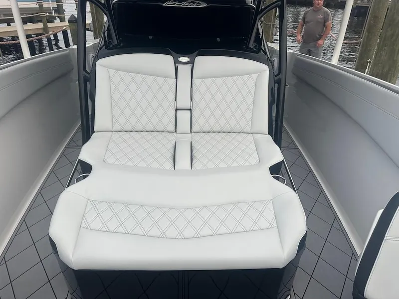 Slide: The Image of 2024 Nor-Tech 340 Sport Center Console with luxurious seating and sleek design. - 19