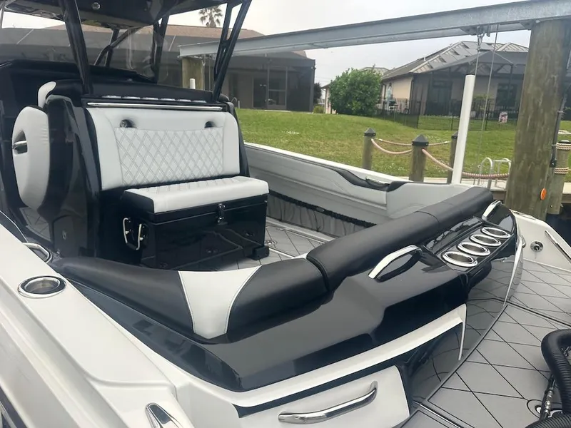 Slide: The Image of 2024 Nor-Tech 340 Sport Center Console boat with luxurious seating and sleek design. - 23