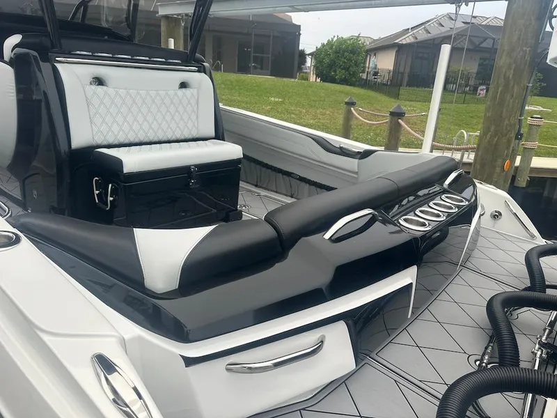 Slide: The Image of 2024 Nor-Tech 340 Sport Center Console boat interior with sleek seating and modern design. - 24