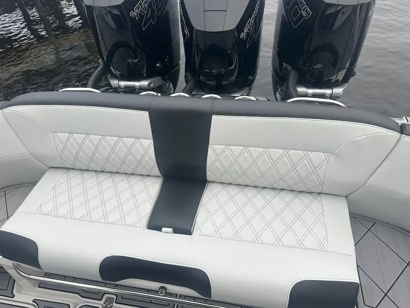 Slide: The Image of 2024 Nor-Tech 340 Sport Center Console with luxurious seating and powerful engines. - 9