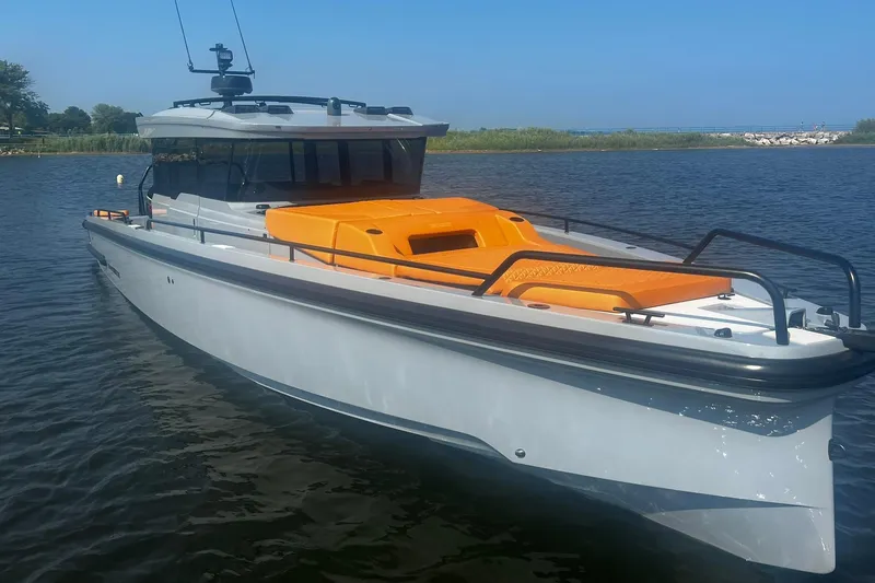 Slide: The Image of 2024 BRABUS Shadow 900 XC Cross Cabin boat on calm water. - 10